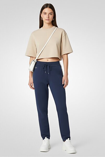 Lacoste بنطلون رياضي نسائي بقصّة عادية وشعار العلامة التجارية، أزرق داكن