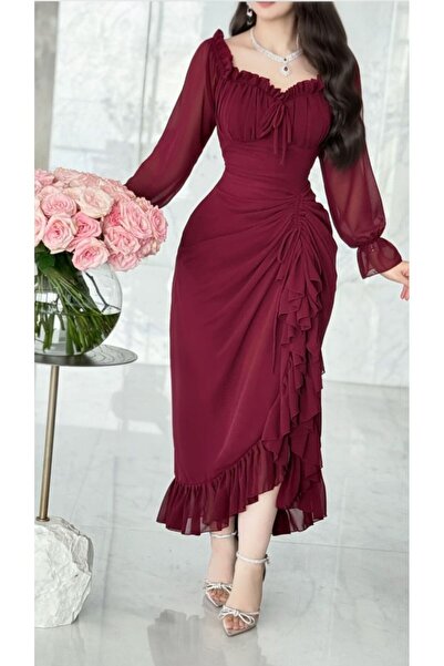 Kayla A burgundy chiffon dress featuring a fitted silhouette and a small tie ...