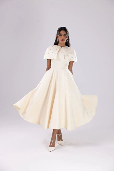 Azyaa Al-Amira Royal white evening gown with a crystal-embroidered cape shoulder