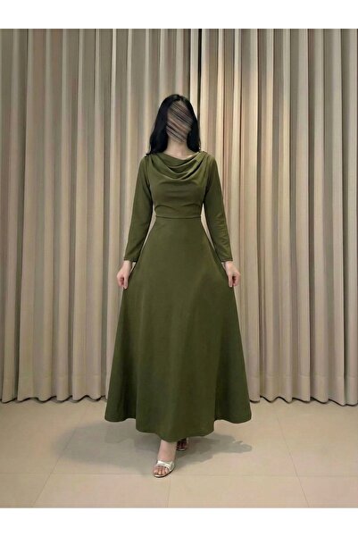 DUBAİ An elegant olive-colored dress, featuring a sophisticated design that s...