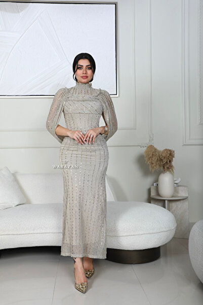 Warazan A soft, fitted dress with an off-the-shoulder cut