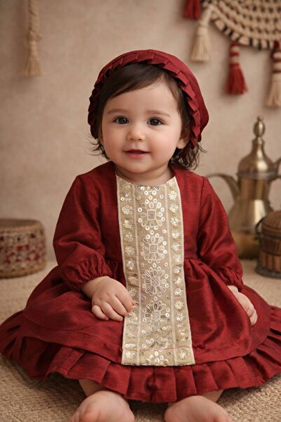 La reina petite A traditional burgundy dress with a hat from Larina Petite