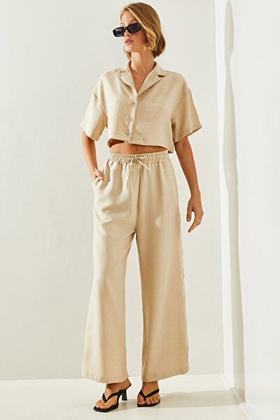 Hiccup Bianco Lucci two-piece set with cropped top and jacket collar and pant...