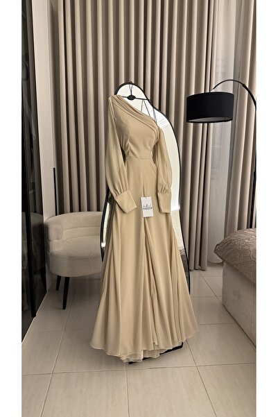 Nareen Fashion A long, light beige dress with an elegant and soft design, fea...
