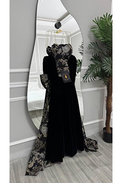 MANGONA Black velvet evening gown with a gold jacquard bodice and dramatic tr...