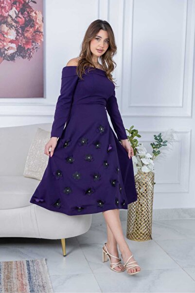 leon A delicate, captivating dress with a laser-cut rose design.