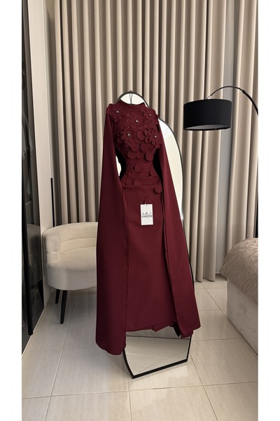 Nareen Fashion An elegant burgundy dress with a sophisticated design that com...