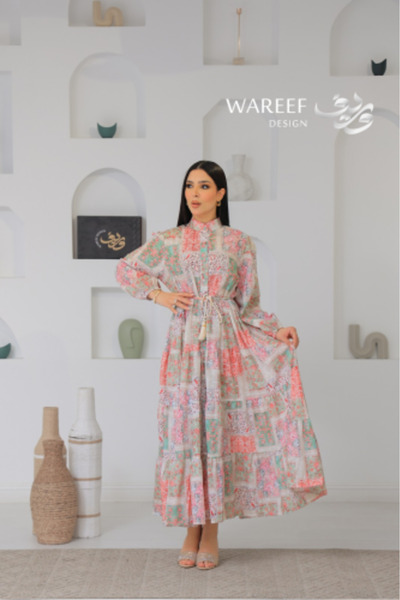 WAREEF FASHION A soft jalabiya with a traditional multi-square pattern and a ...