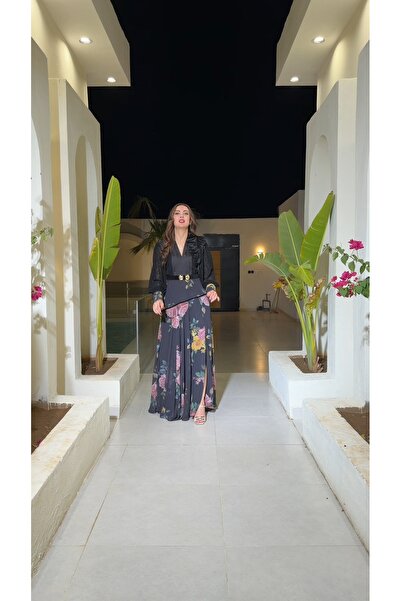 REVE A black dress with a floral touch, featuring an embroidered bodice and a...