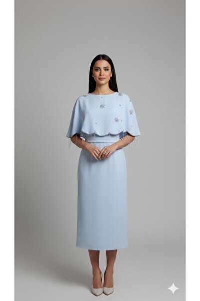 Azyaa Al-Amira A soft, sky-blue evening gown with an embroidered cape and cas...
