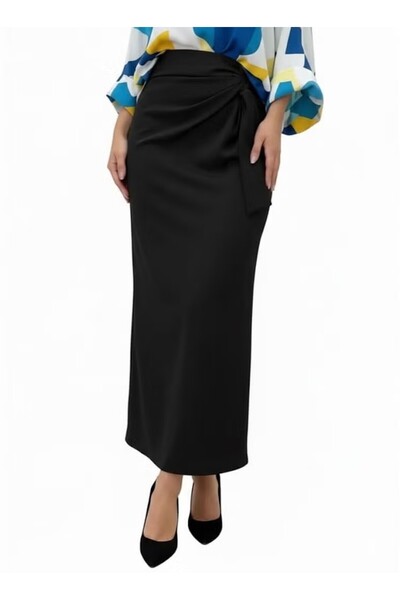 FULLJOY A long, flowing skirt; an elegant skirt with a side knot detail that ...