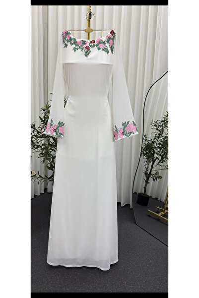 AREEJ FASHION A white jalabiya with elegant pink embroidery.