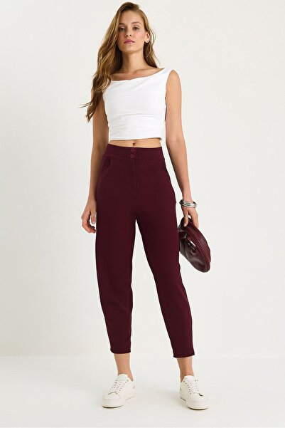 Hiccup Long crepe trousers with carrot pattern and button closure