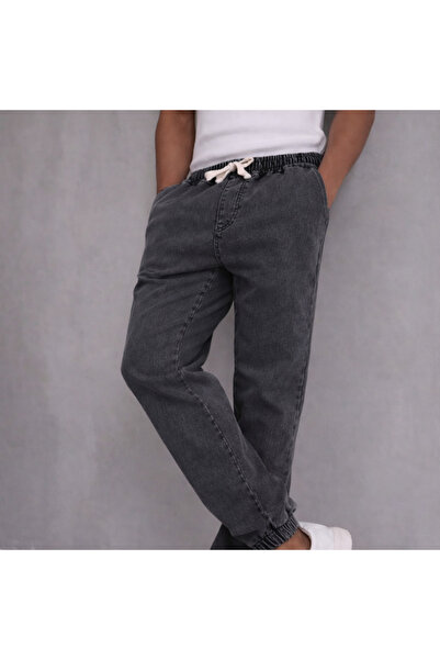 MASTIFF بنطلون جينز رجالي بقصة مريحة مع تفاصيل مطاطية عند الأرجل