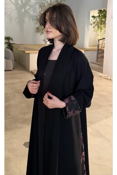VELORA عباية لورا السوداء نص كلوش بتصميم واسع ولمسة سعودية راقية – عباية نسائ...