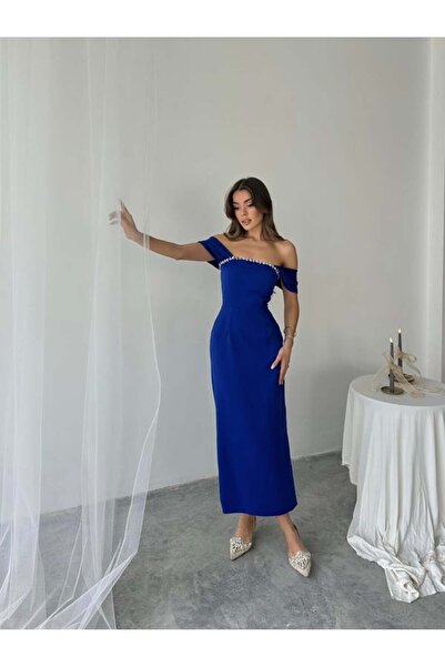 Miss Janell A soft blue dress with distinctive details on the bodice - Made i...