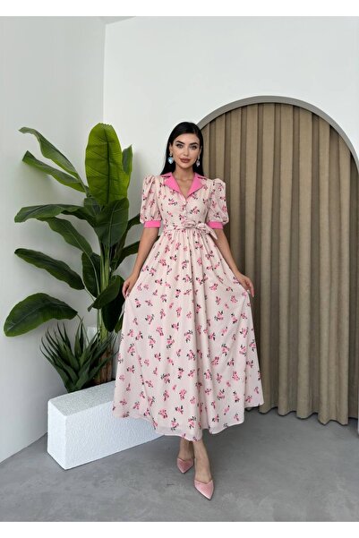 Etika Women's long dress with short sleeves and a waist belt, featuring a mod...