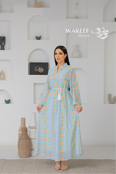WAREEF FASHION A soft jalabiya with a colorful floral pattern and a flowing c...