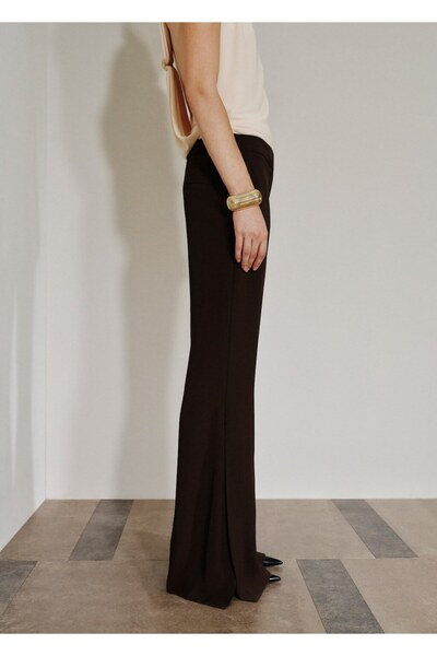 MANGO Woman Yanları yırtmaçlı dökümlü pantolon