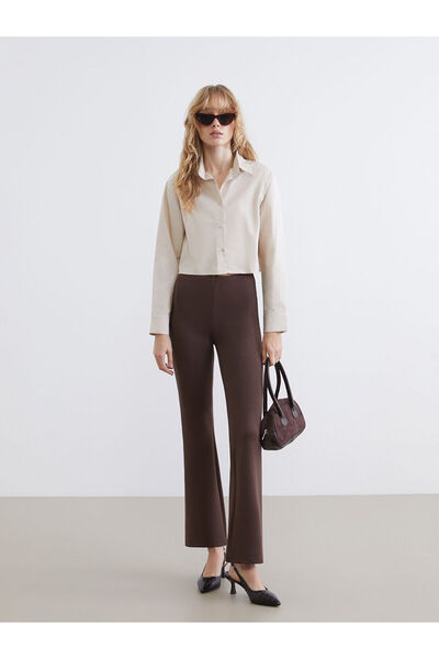 LC Waikiki مجموعة إلسيفا: بنطلون نسائي بخصر مطاطي بني اللون واسع الأرجل على ا...