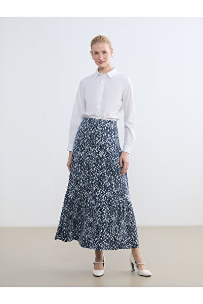 LC Waikiki تنورة من مجموعة إلسيفا باللون الأزرق الداكن مع خصر مطاطي وتصميم عل...