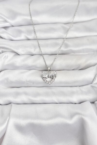 BSRE قلادة نسائية فضية اللون على شكل قلب وفيونكة مرصعة بحجر الزركون (فولاذ 316L)