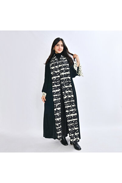 HAWRAA ABAYA An abaya made of soft black velvet with a yellow Printed chiffon...