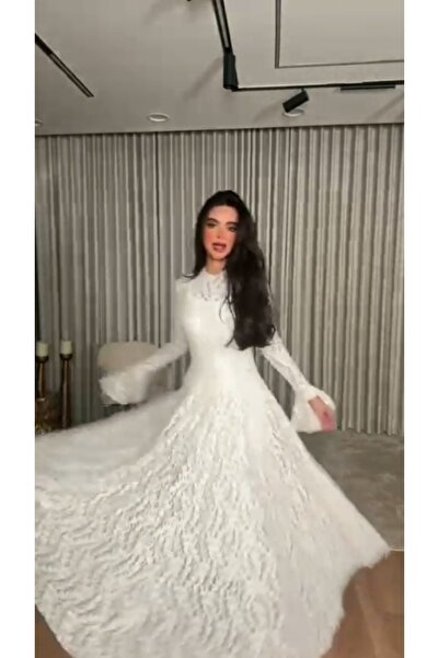 Azyaa Al-Amira A soft white lace dress with long sleeves and a bell design - ...