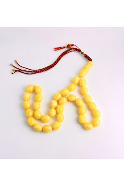 221331 An elegant rosary made of amber dust, with a handmade tassel.