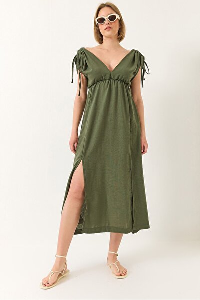 Hiccup Bianco Lucci dress with V-neck, elastic waist and slits, with knot det...