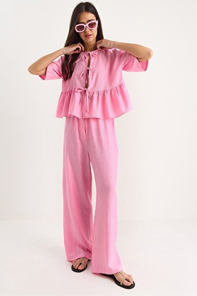 Hiccup Bianco Lucci two-piece set for short-sleeved blouse and knotted trousers