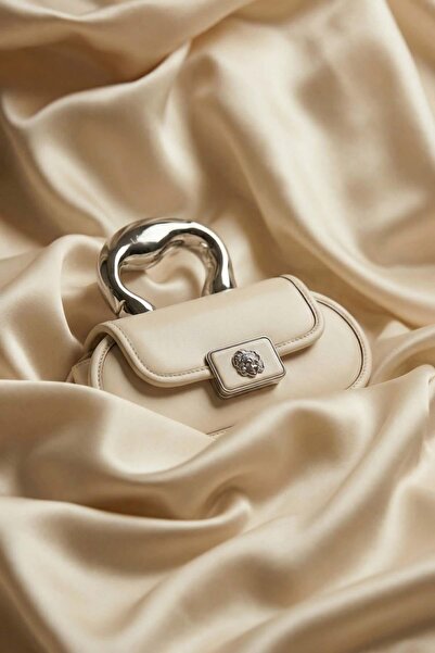 Levidor Cream Oval Handbag with Metal Accessories