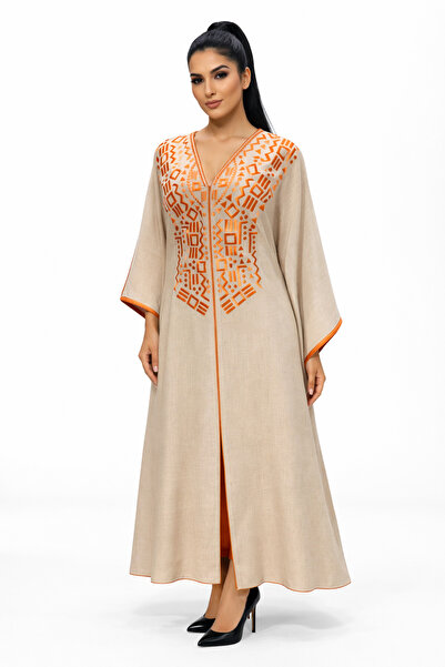 Al Afnan Boutique A stylish and distinctive beige jalabiya adorned with embro...