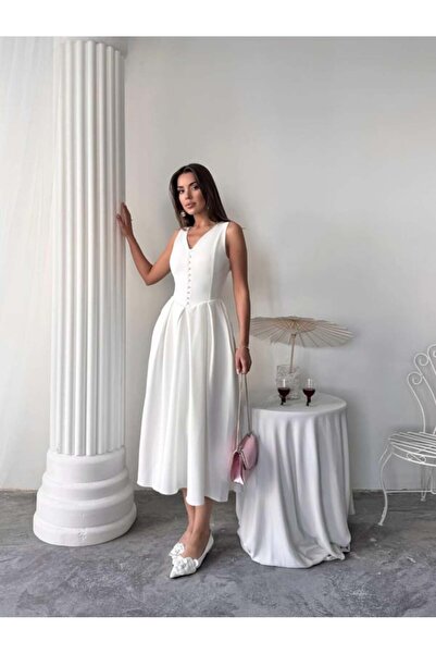 Miss Janell Elegant and soft white women's sleeveless dress adorned with dang...