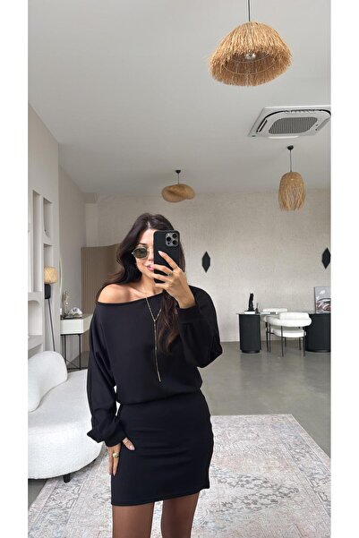 Buket Teke Modal Dress Sitting on a Black Skirt