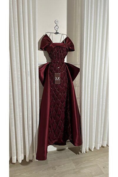 Ora A burgundy dress with beadwork and a matching back panel.