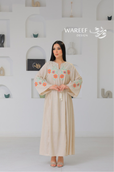 WAREEF FASHION A soft jalabiya with colorful floral embroidery and elegant he...
