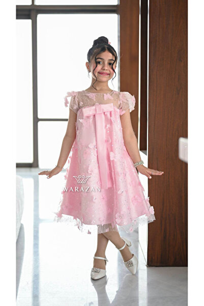 Warazan Pink children's dress with a bow at the chest