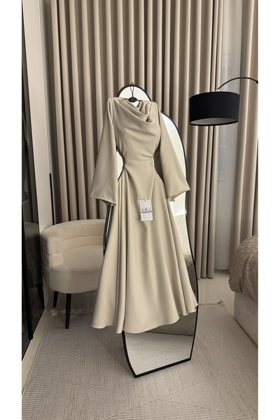 Nareen Fashion An elegant dress in a soft beige hue, with a sophisticated des...