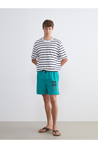 LC Waikiki شورت سباحة رجالي قصير مطبوع باللون الأخضر