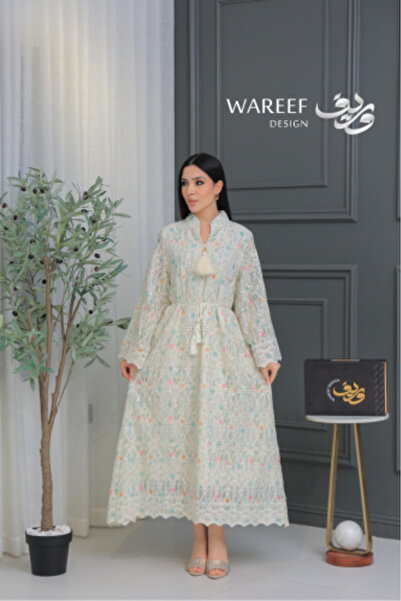 WAREEF FASHION A soft, off-white lace jalabiya embroidered with floral patterns