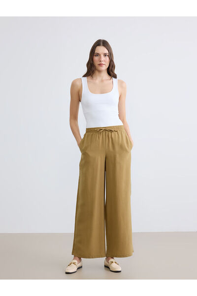 LC Waikiki Πράσινο γυναικείο παντελόνι με ελαστική μέση και φαρδιά μπατζάκια