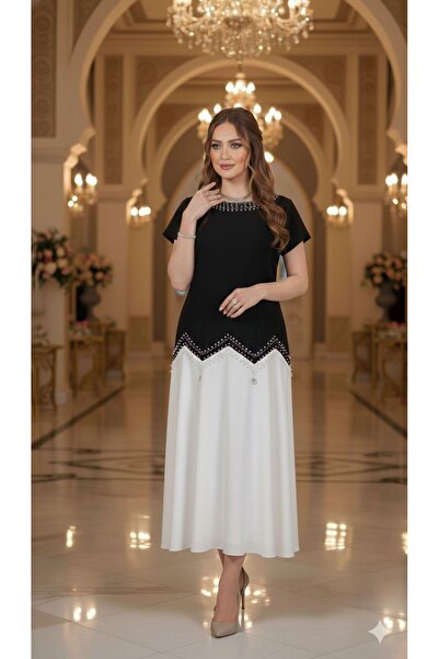 NARCISSUS FASHION An elegant evening dress with an asymmetrical design and lu...