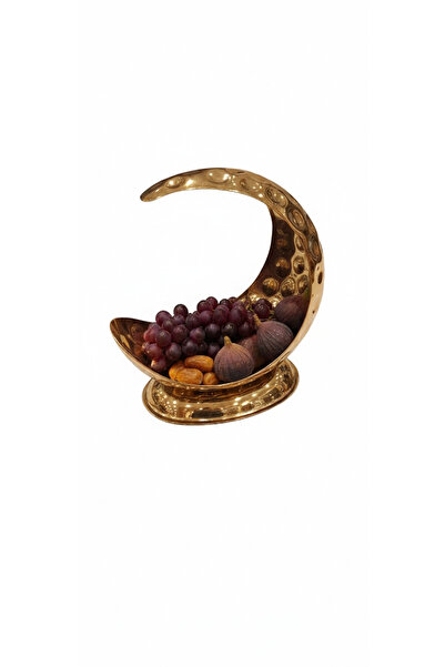 HIGHLAND A crescent-shaped stainless steel fruit serving bowl.