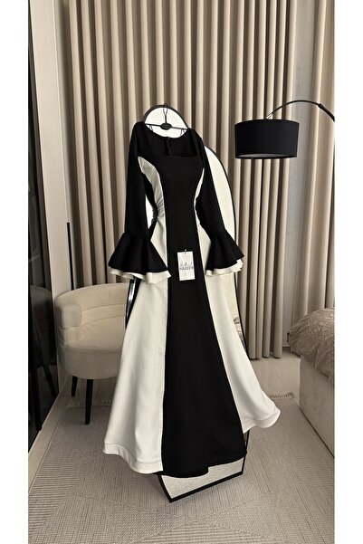 Nareen Fashion A stylish two-tone dress combining black and white to give you...