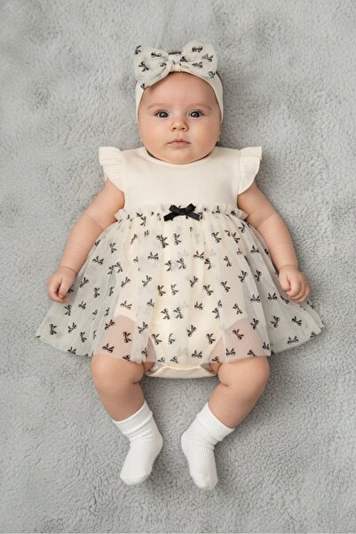Baby Starters فستان بناتي صغير مكون من قطعتين بطبعة رسومية مع ربطة رأس، بيج