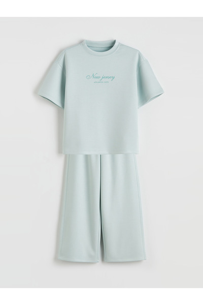 LC Waikiki تيشيرت وبنطلون مطبوع للبنات.