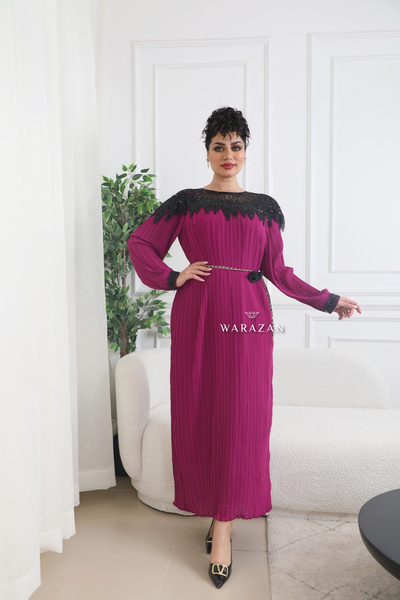 Warazan A royal dress with sequins on the bodice, a rose at the waist, and a ...