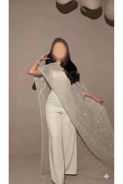 REVEA Elegant beige jumpsuit topped with a long cape embroidered with luxurio...