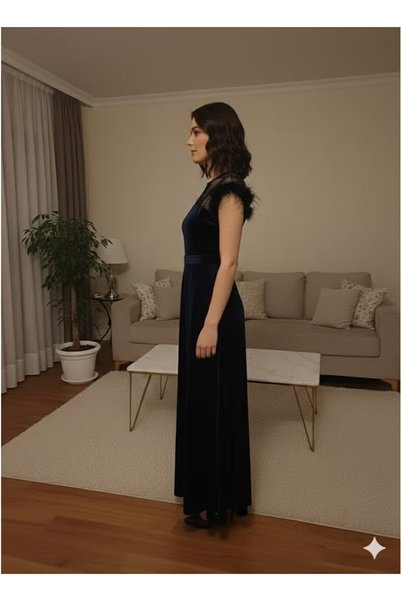 FULLJOY A long velvet evening dress with an elegant and modern design, featuring feminine mesh details at the bust and a belt at the waist.